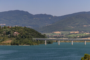 The Bilancino Lake. Lago di Bilancino, Barberino del Mugello, Florence, Italy: landscape at dawn of the picturesque lake in the Tuscan hills