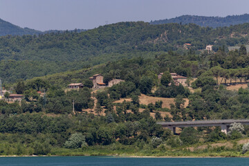 The Bilancino Lake. Lago di Bilancino, Barberino del Mugello, Florence, Italy: landscape at dawn of the picturesque lake in the Tuscan hills