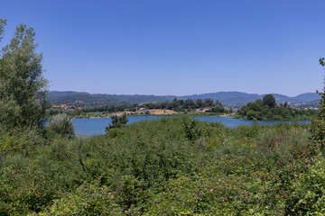 The Bilancino Lake. Lago di Bilancino, Barberino del Mugello, Florence, Italy: landscape at dawn of the picturesque lake in the Tuscan hills