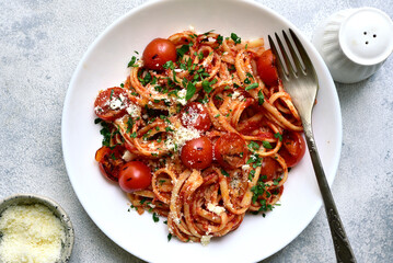 Traditional italian pasta with grilled tomatoes, parmesan and garlic. Top view with copy space. - 782479449