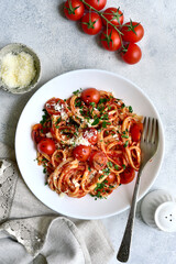 Traditional italian pasta with grilled tomatoes, parmesan and garlic. Top view with copy space. - 782480494