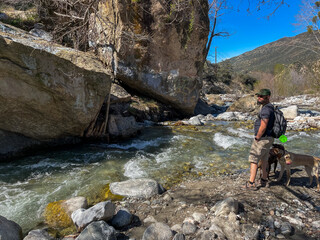 The Thurman Flats Area in the San Bernardino National Forest looking at the Mill Creek and the Rocky Area with a Man and his Dogs enjoying the Day