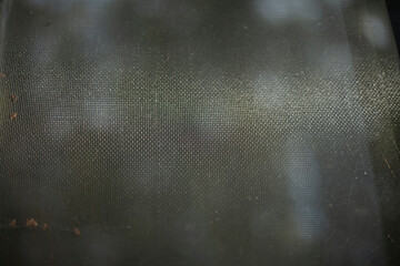 Fabric texture. Fabric on glass. Light through the window.