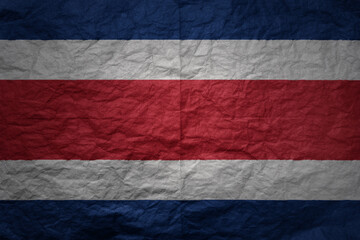 big national flag of costa rica on a grunge old paper texture background