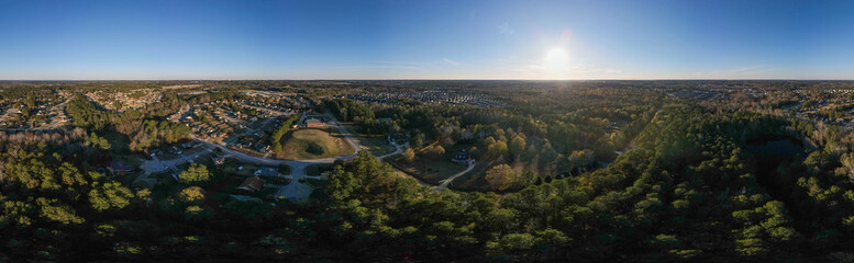 Aerial sunset landscape of suburban neighborhood Euchee Creek Trails in Grovetown Augusta Georgia