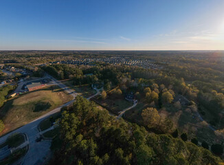 Aerial sunset landscape of suburban neighborhood Euchee Creek Trails in Grovetown Augusta Georgia