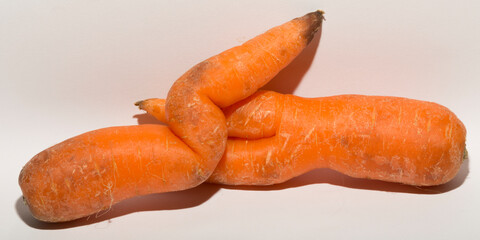 Two crooked carrots are mutants. Association of erotic intimacy.