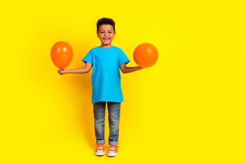Full body photo of little mixed race child dressed blue t-shirt jeans hold bubbles on birthday...