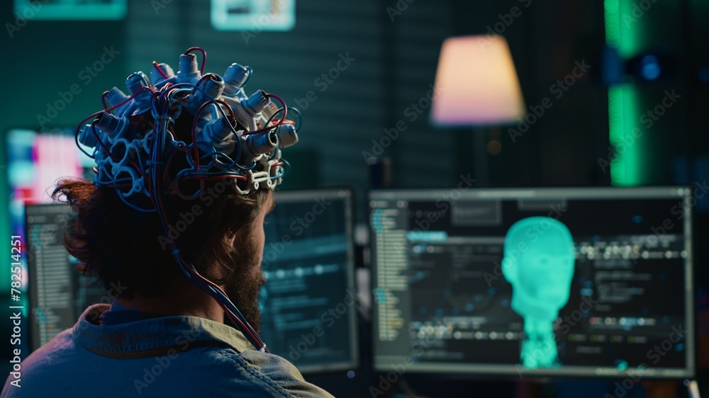 Aufkleber developer with eeg headset on programming brain transfer into computer virtual world, becoming one w