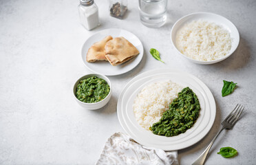 Spinach dahl with rice in a plate