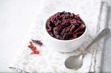 Dried Karkade tea leaves in a bowl - 782518075