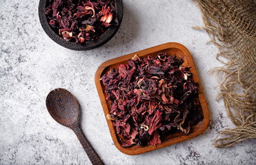 Dried Karkade tea leaves in a bowl - 782518092