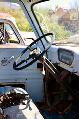 vintage pickup truck in a desert junkyard