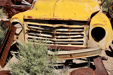 faded yellow vintage pickup truck in the junkyard © Heidi Patricola