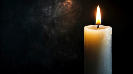 white candle lit in a dark room in high resolution and high quality. lighting concept