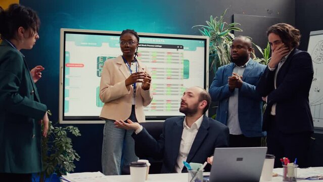 Joyful supervisor accidentally kissing his employee in excitement, being too cheerful and excited about the new team achievement. Irritated woman slapping him after kissing her. Camera B.