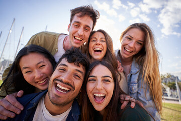 Portrait of group diverse young happy people looking excited at camera and having fun together...