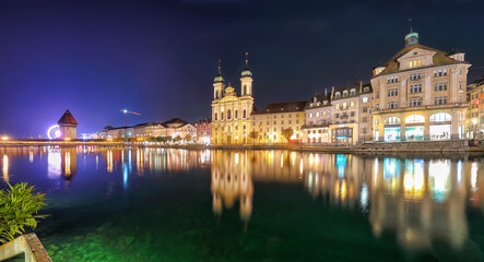 Fototapeta na wymiar Fabulous historic city center of Lucerne with famous buildings and promenade during night.