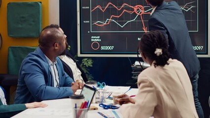 Business team trying to eliminate risks of unforeseen events and disruptions, discussing supply chain resilience and contingency planning. Diverse staff members accomplishing goals. Camera A.