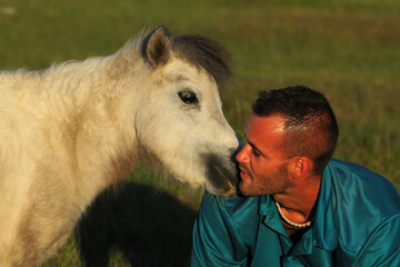 Mini Pony Kissing Man