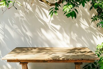 Empty wood table with plants and shadows outdoors for product advertising mockup