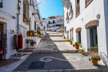 Stairway sidewalk with pretty flower pots in the village of Frigiliana Spain