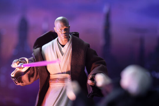 NEW YORK USA, APRIL 27 2019: Jedi Master Mace Windu confronting senator Palpatine with Coruscant cityscape in background. - Hasbro figures
