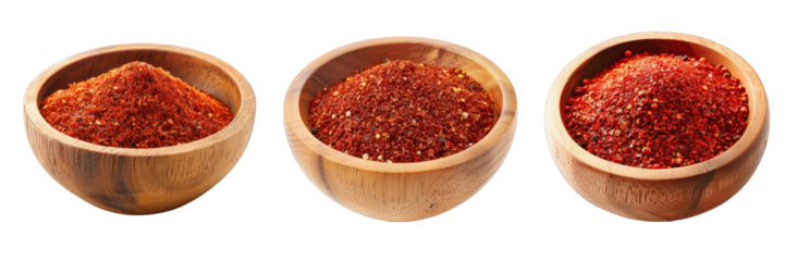 Set of ground red hot peppers in wooden plates. Hot chili pepper, ground. Transparent background, isolated image