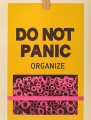 Rolls of paper and the text 'Do not panic, organize'."Minimal creative business concept.Flat lay