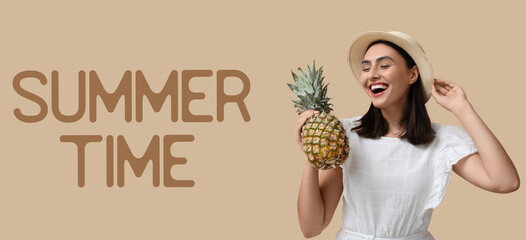 Beautiful young woman with fresh pineapple on beige background