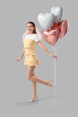 Happy bridesmaid with balloons on light background. Hen Party