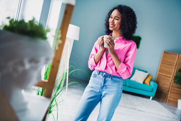 Photo of pretty young girl drink coffee breakfast wear trendy pink outfit modern interior indoors cozy daylight apartment