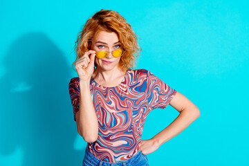 Portrait of nice lady touch sunglass look camera wear t-shirt isolated on teal color background