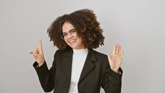 Cheerful hispanic woman with curly hair, holds up six fingers, flashing a radiant smile! beautifully on-point, standing solo against a stark white backdrop.