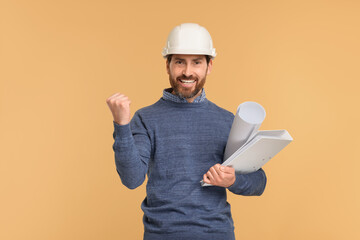 Architect in hard hat with draft and folder on beige background