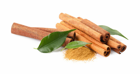 Dry aromatic cinnamon sticks, powder and green leaves isolated on white