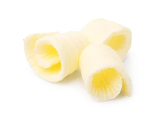 Rolgordijnen Fresh tasty butter curls isolated on white © New Africa