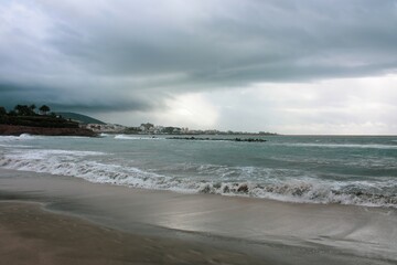 Dramatic and Moody Scene at the Beach and a Stormy, Ominous Sky in the Background, Creating a Sense of Mystery and Intrigue.