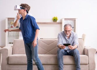 Boy and his father and his grandfother indoor - 782620293