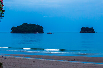 Yachts Anchored Peacefully on the Waters of Whangamata Beach, Creating a Serene and Picturesque Seascape