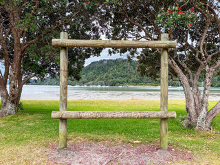 A Wooden Frame with 'Whangamata' Inscribed, Welcoming Visitors to the Beach Road Reserve