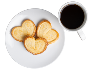 three Palmiers (Elephant Ears) cookies on a plate with a transparent background