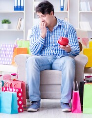The young man after excessive shopping at home - 782621647