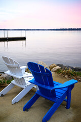Adirondack chairs and tranquil relaxing sunset landscape at Schluter Beach in Monona Lake, Dane County, Wisconsin, United States, a suburb of the state capital Madison