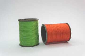 Two skeins of thread on a white background