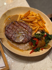 beef steak in ceramic plate