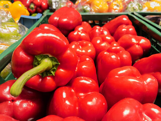 Fresh Red Bell Peppers on Display at Produce Market