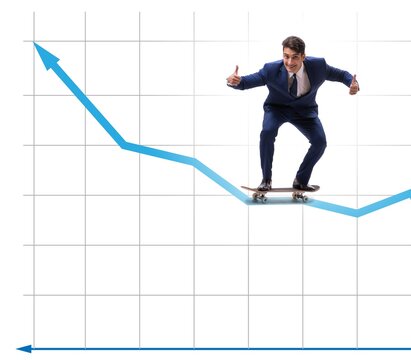 Businessman riding skateboard on financial graph