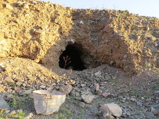 Abandoned Mine Site with Rusty Bucket in Arizona Desert