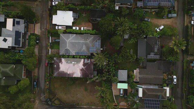 Top aerial view of countryside landscape on Oahu Island. Small town on cloudy day in Honolulu, Hawaii. High quality 4k footage